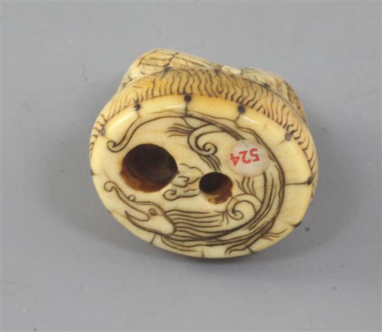 A Japanese ivory netsuke of a cockerel seated on an oval box, 19th century, 4.3cm high